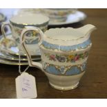 A Staffordshire crown tea service with blue rim and floral and foliate depictions, consisting of