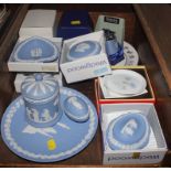 An array of Wedgwood blue and white plates, ornaments, etc