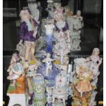 A selection of early 20th century multicoloured porcelain figurines (9)