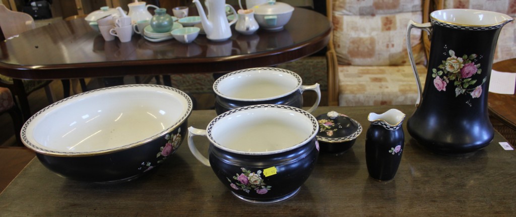 An early 20th century ceramic ewer and bowl, a pair of chamber pots, one circular bowl with lid