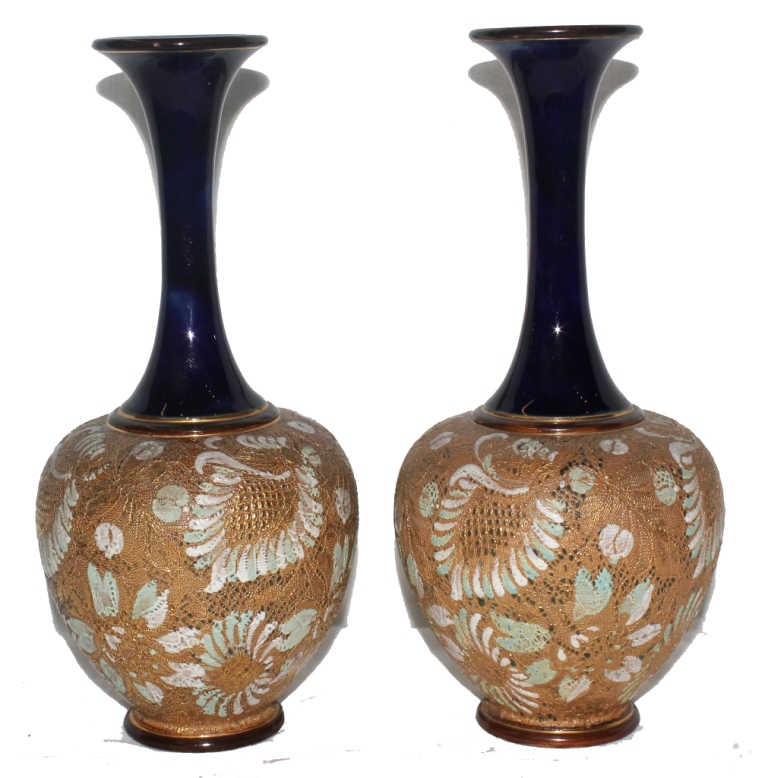 A pair of early 20th century Royal Doulton Slaters, baluster shaped vases with glazed stems,