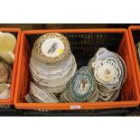 A large selection of mid and early 20th century hanging plates, bowls, etc