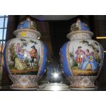 A pair of Dresden baluster vases with domed lids with painted plaques, 35 cm high