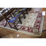 An ivory ground all over design wool carpet with multicoloured floral decorations, 290cm x 200cm