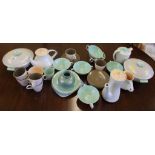 A collection of vintage Poole Pottery tableware in twin tone colours, ice green/ mushroom, peach