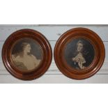 A pair of Edwardian prints of ladies in circular mahogany frames, 20 cm diameter