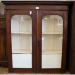 A 19th century mahogany display cabinet with shaped cornice, twin glazed doors, white painted
