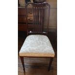 An Edwardian-style mahogany dining chair with shaped inlaid top rail, fret work to the splat, fabric