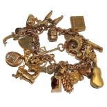 A 9 carat gold charm bracelet with over twenty charms 53.1 grams
