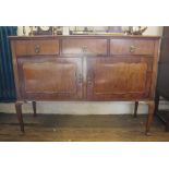 An early 20th century mahogany sideboard with tray back shaped top, three drawers under and two