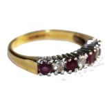 An 18 carat gold seven stone ruby and diamond ring