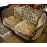 A 19th century-style French walnut two-seater settee with profusely carved top rail and supports