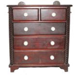 A Victorian oak stained miniature chest of two small and three graduated drawers with shaped top,