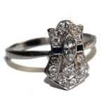 A platinum Art Deco cluster ring, rub set with one central marquise diamond flanked by one