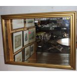 A contemporary oblong bevelled edge wall mirror with gilt wooden frame, 75cm x 104cm