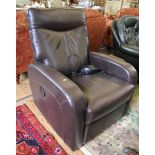 A Dewert electrically operated adjustable arm chair with brown leather upholstery, rounded arm