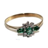 A 9 carat emerald and diamond ring