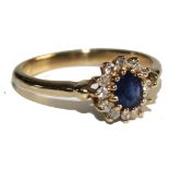 A 9 carat gold sapphire and diamond cluster ring