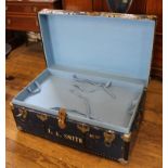 An early 20th century metal bound travelling or storage trunk with lined and fitted interior, 90H