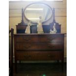 An Edwardian mahogany and cross banded dressing chest with oval mirror with finial topped