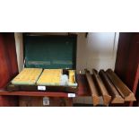 A mahjong set in stained oak box and four stands