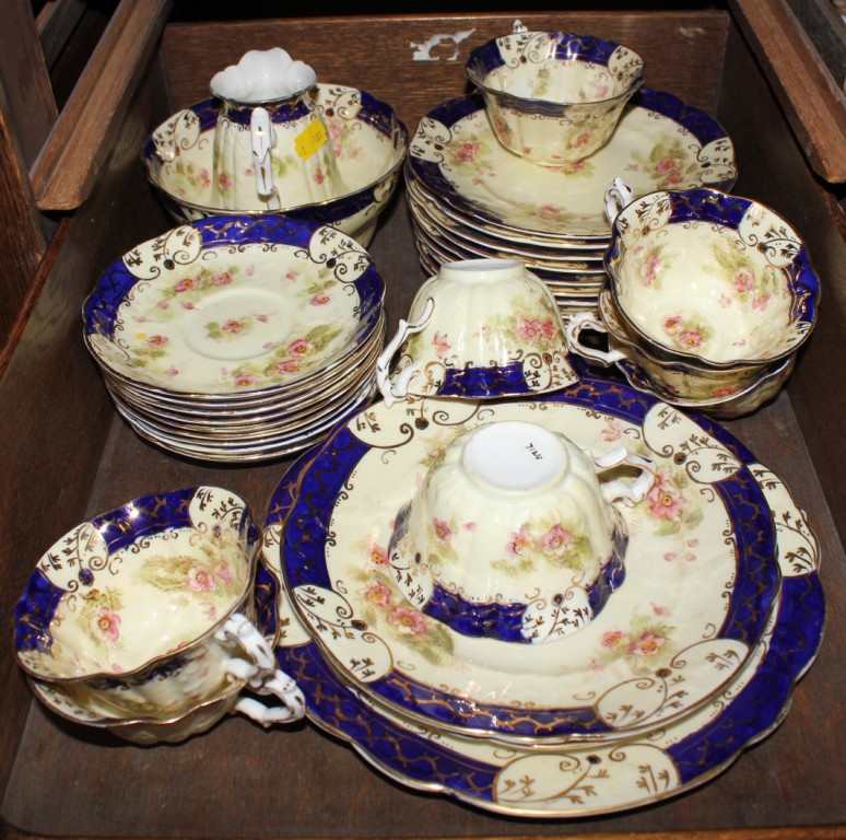 A 19th century tea service, to include cups, saucers, plates, etc, with blue rims and