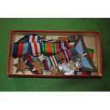 A selection of World War II medals, ribbons, etc