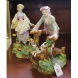 A pair of late 19th century / early 20th century Continental-style figurines of a lady and gent in