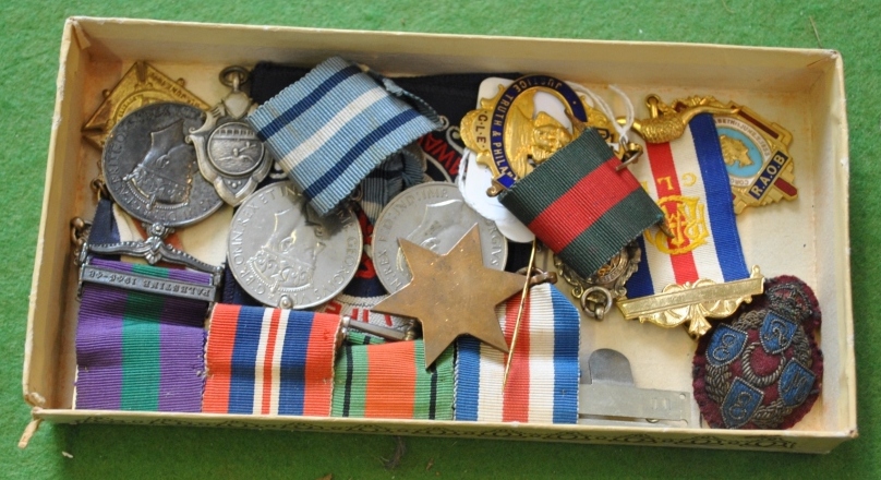 A small selection of silver swimming medals, etc