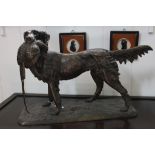 A bronze figure of a hunting dog with fowl by P.J. Mene, 42cm x 65cm on a stylised oblong base  £