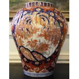 A 19th century Japanese Imari baluster style vase with blue and ochre floral and foliate depictions,