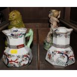 A pair of 19th century Royal Terra Cotta stoneware hydra jugs, a Meissen figurine of a boy and