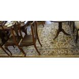 A Middle Eastern-style ivory ground drawing room rug with multicoloured floral and foliate designs