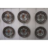 An assortment of six late 19th century Sampson-style French armorial hanging plates with