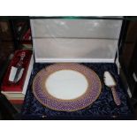 An Oriental-style Royal Bone china circular cake plate with matching cake knife with multicoloured