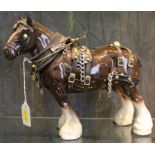 A Beswick-style Clydesdale horse with full tack, 24cm x 30cm £30-50