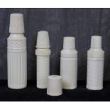 Four ivory cylindrical sewing cases, 7cm - 9.5cm high The Art Deco Carvings of W. G. Collins (1872-