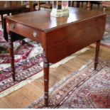 A 19th century mahogany Pembroke table with twin drop leaves, one drawer under with brass drop