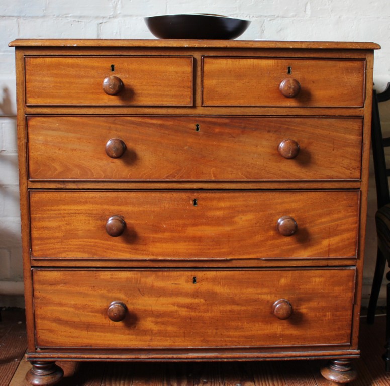 A Victorian mahogany chest of two small and three large graduated drawers with turned handles,