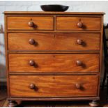 A Victorian mahogany chest of two small and three large graduated drawers with turned handles,