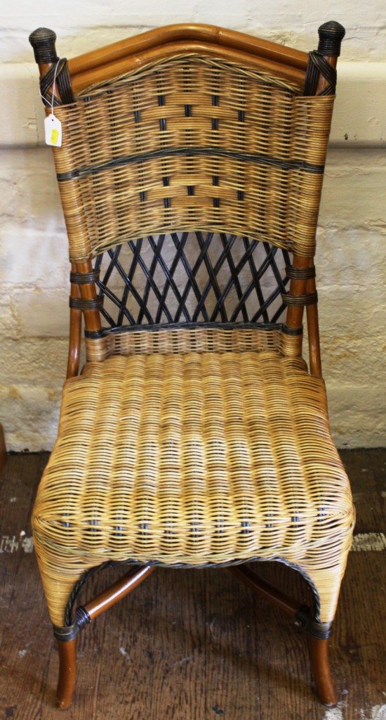 A bamboo framed occasional chair with wicker support and seat, arched top rail, raised on sabre legs