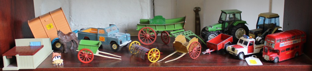 Britains farm vehicles and equipment, including Tumbrel cart and two Dinky public service vehicles