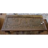 An Oriental hardwood coffee table of oblong form with glass top with profuse flat top carving