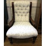 A Victorian mahogany framed fabric upholstered lady's chair with button back support, serpentine