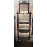 A 19th century style oak stained whatnot with five shelves, raised on turned supports, 136H x 48W