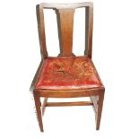 A set of six early 20th century mahogany dining chairs with shaped splats, leather upholstered