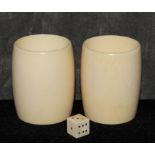 A pair of shaped ivory dice shakers, 6cm high The Art Deco Carvings of W. G. Collins (1872-1959)