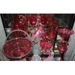 A selection of late 19th century, early 20th century cranberry glass, to include swing handle