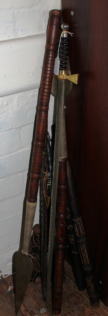 An assorted lot of tribal spears, knives and swords, most from Easter Island