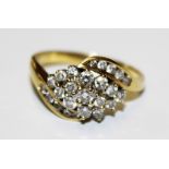 An 18 carat gold diamond cluster ring